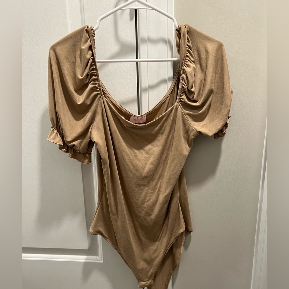 Pink Lily size large body suit.